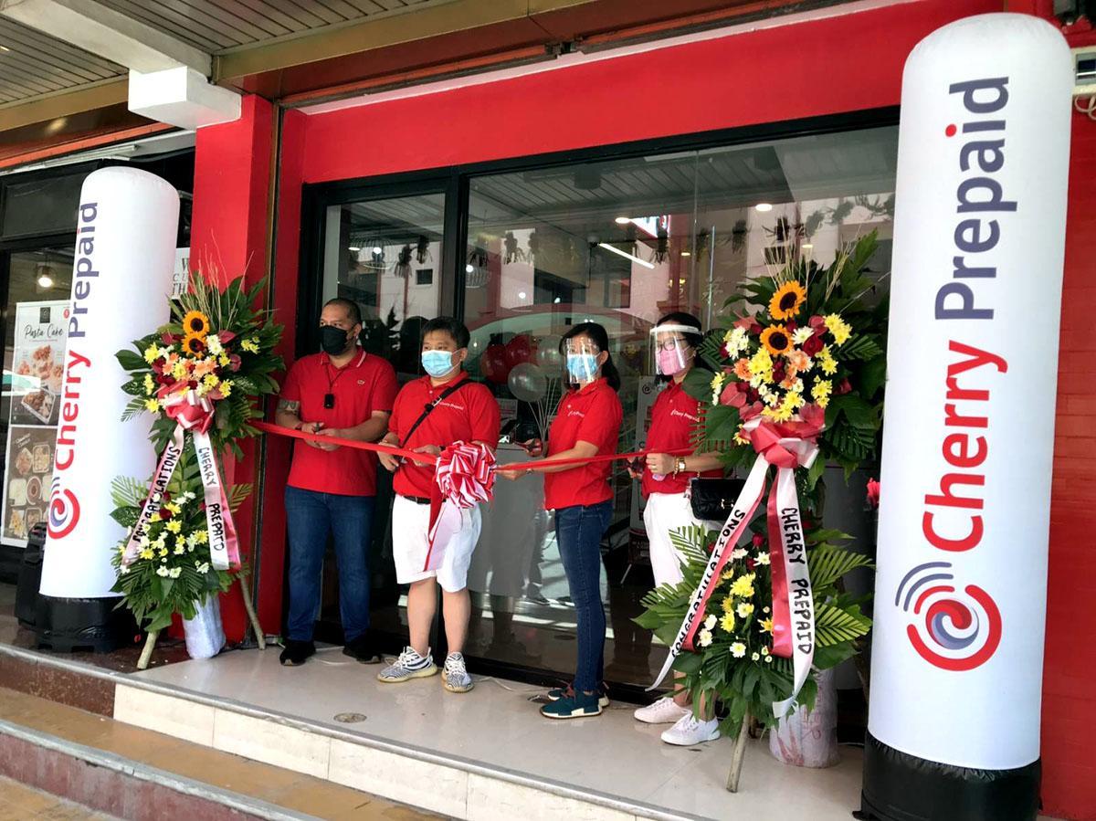 Cutting of ribbon for Lucena, Quezon Cherry Prepaid Concept Store