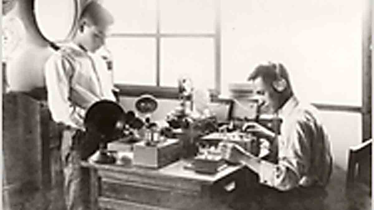Sharp Founder Tokuji Hayakawa (right) testing a radio sample